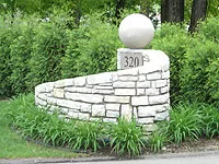 Facer perennials tie this decorative wall to the ground Facer perennials tie this decorative wall to the ground